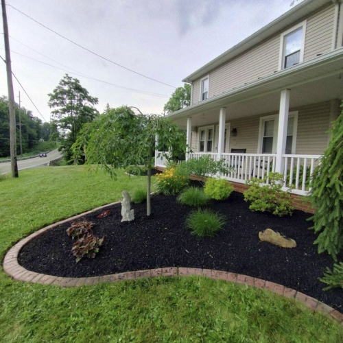 Landscaping and mulch work by Custom Cut Lawn Care
